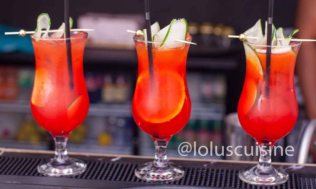 three cocktails in a row on bar
